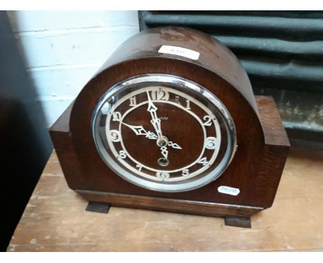 An Enfield oak mantel clock. 