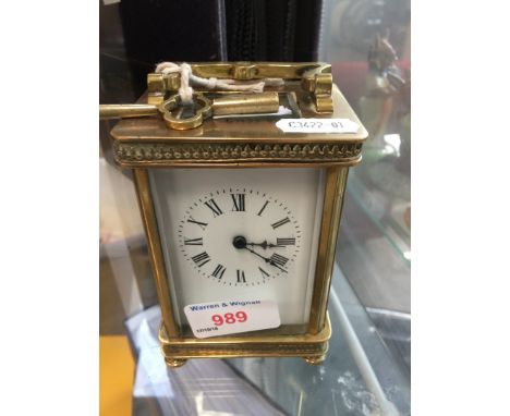 A French brass carriage clock with key 
