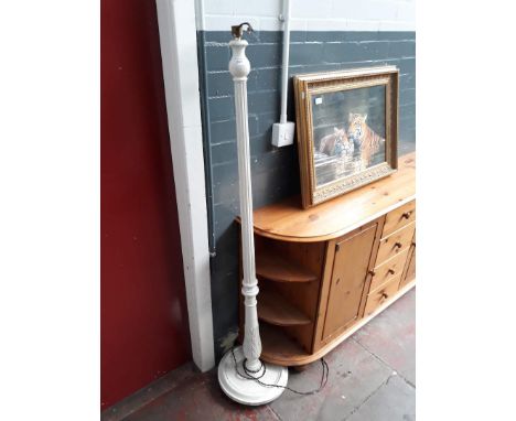 A white painted lamp standard. 