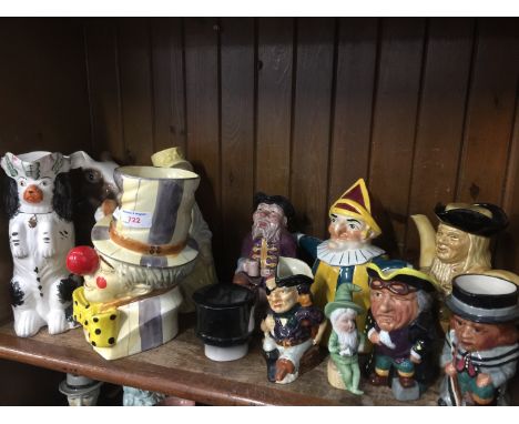 Shelf of pottery and toby jugs 