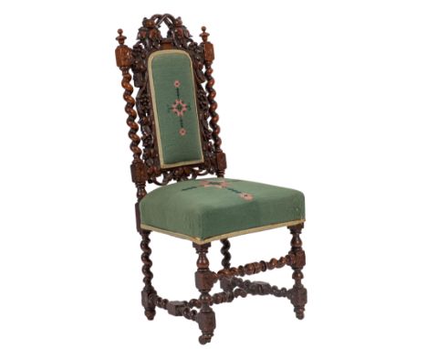 A carved walnut and tapestry upholstered side chair in Charles II style, circa 1880; the backrest with openwork foliate carve