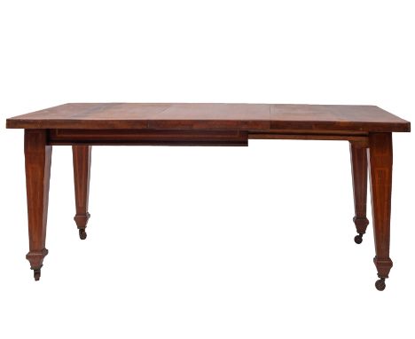 An Edwardian mahogany and satinwood banded extending dining table, early 20th century, the rectangular top with one extra lea