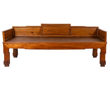 A Chinese hardwood and rattan canework day bed, 20th century; the cleated rectangular top with panelled back and sides; the f