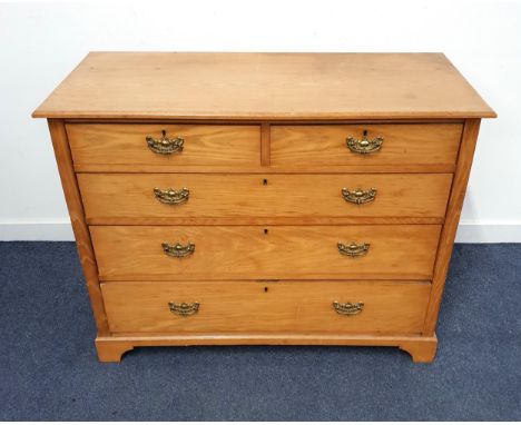 LIGHT OAK CHEST OF DRAWERSwith a rectangular moulded top above two short and three long graduated drawers standing on bracket