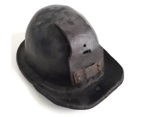 20th CENTURY CHILDS LEATHER MINERS HELMETwith impressed '56' to the brim and leather flap for lamp fixture 