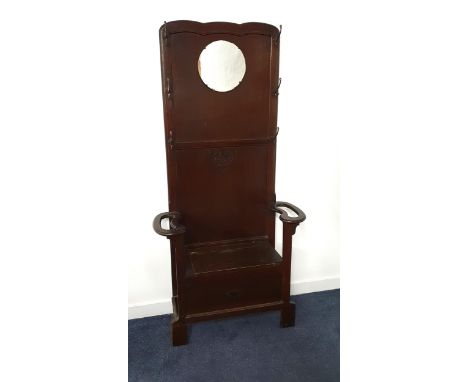 1930s OAK HALL STANDwith a circular mirror and an arrangement of six coat hooks above a lift up seat flanked by combination s