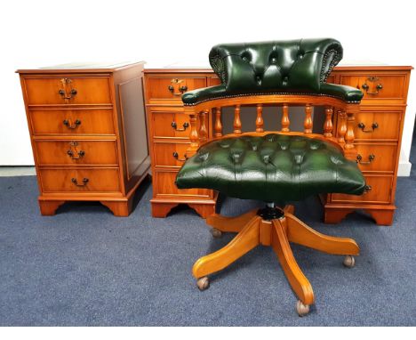 YEW VENEER KNEEHOLE DESK AND CAPTAIN'S CHAIR the desk with an inset leather effect top above an arrangement of nine drawer, 1