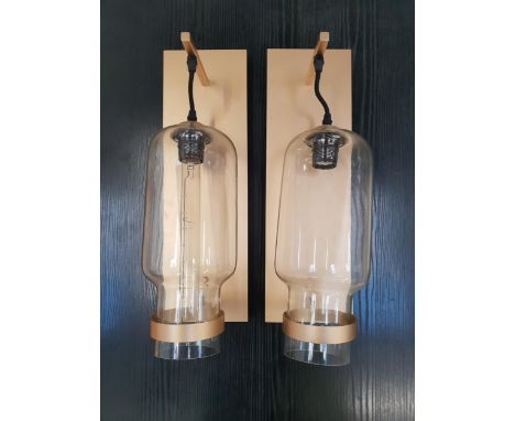 PAIR OF BRASS HALL LIGHTSwith rectangular brass wall plate and arm, the shaped cylindrical glass shade, one with decorative l