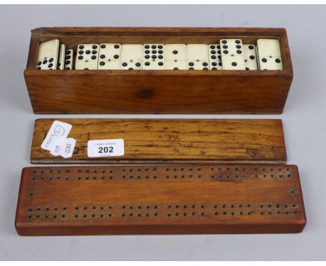 Dominoes set together with cribbage board 