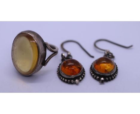 Pair of silver and amber set earrings together with ring 