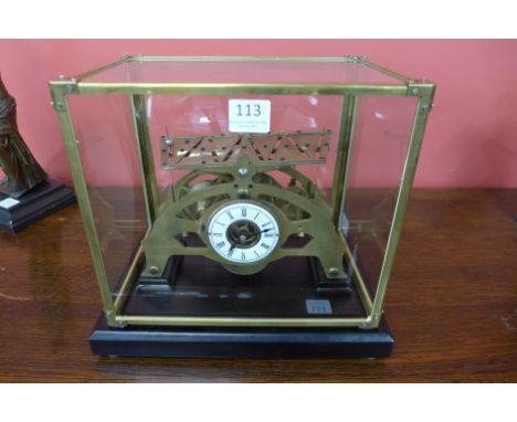 A Congreve style brass fusee rolling ball clock, glass case and ebonised stand