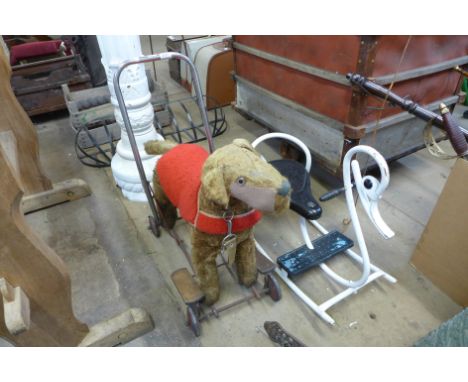 A vintage child's toy pull-along dog, rocker and clock