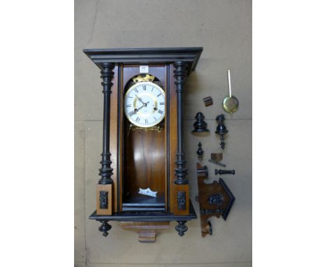 A walnut and ebonised 31-day Vienna wall clock