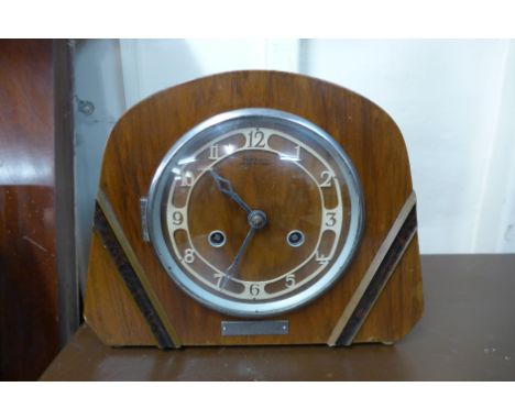An Art Deco walnut mantel clock