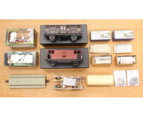 Model Railway: A pair of completed kit built possibly Gauge 1 wagons, together with a pair of model kits unbuilt, two boxed W