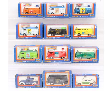 Tomica: A collection of twelve boxed Tomica Dandy 1:43 Scale vehicles. Contents appear in a very good condition, some slight 