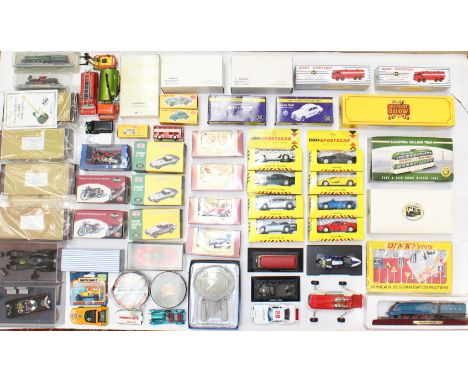 Diecast: A collection of assorted boxed and unboxed diecast vehicles to include: vintage unboxed and modern Atlas Editions bo