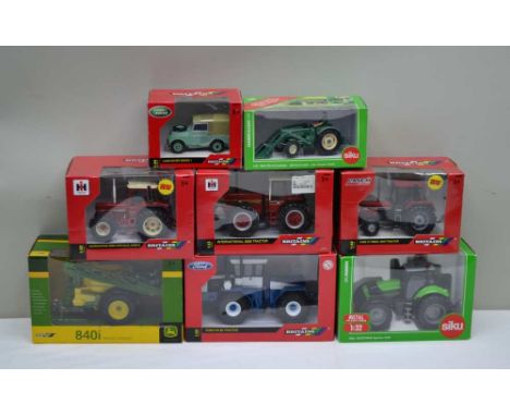 A SELECTION OF BRITAINS ' BRANDED AGRICULTURAL VEHICLES, to include; Ford FW 60 Tractor 1:32 scale ref:42492, Land Rover seri