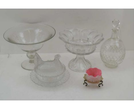 A MOULDED GLASS HEN FORM BUTTER DISH, two stemmed fruit bowls, a cut glass jug decanter &amp; stopper, an opaque glass bon-bo