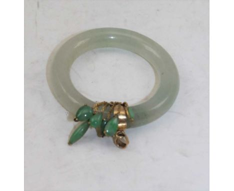 A RING FORM JADE PENDANT with 14ct gold mount, 4.5cm diameterCondition Report – Condition good, no chips, cracks, or repairs.