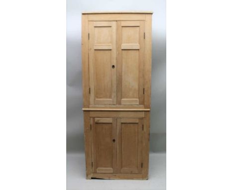 A 20TH CENTURY PINE HALL / PANTRY CUPBOARD having two sets of doors, the upper having three shelves inside and the lower one 