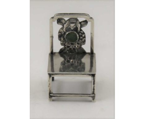 AN EARLY 20TH CENTURY CHINESE SILVER MINIATURE CHAIR inset stone to back, 5cm high, stamped HC (Hung Cheong of Canton and Sha