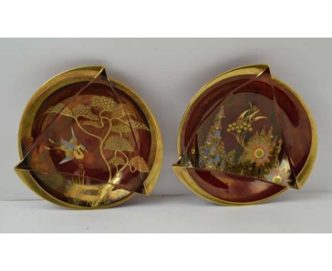 TWO ART DECO CARLTONWARE BOWLS, moulded forms, rouge royale ground, gilded decoration, one with heron in flight, 26cm in diam