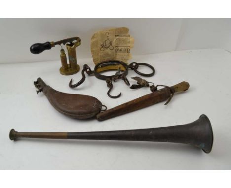 AN EARLY 20TH CENTURY BRASS &amp; IRON CARTRIDGE LOADER with ebonised handle, a leather shot flask, horn, a knife in scabbard