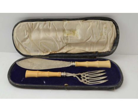 A CASED PAIR OF AESTHETIC DESIGN FISH SERVERS silver with carved ivory bamboo form handles, the slice Birmingham 1880, the fo