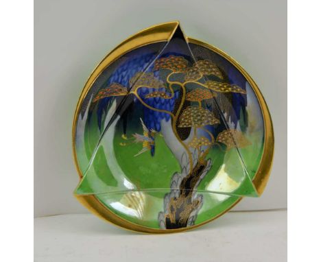 A CARLTONWARE ART DECO HERON & MAGICAL TREE PATTERN LUSTRE BOWL, circular relief moulded, printed factory marks to base, 26cm