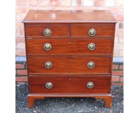 A 19TH CENTURY MAHOGANY CHEST, having plain rectangular top, over two inline drawers, over three further graduating full widt