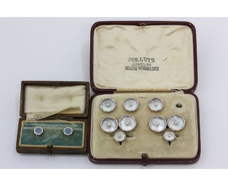 A pair of 14ct yellow and white gold cufflinks with seed pearl and mother of pearl ground; three matching buttons and two stu
