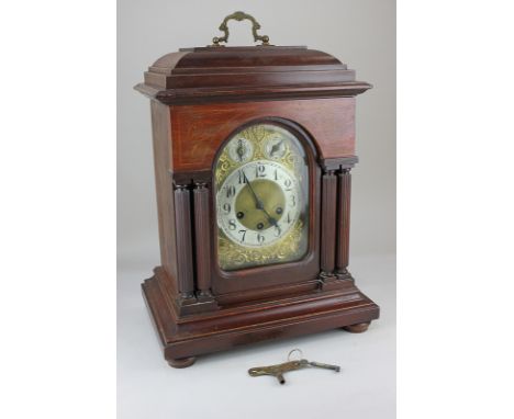A Victorian mahogany chiming bracket clock with arched brass dial, silvered chapter ring, chime/silent, and regulator dials, 