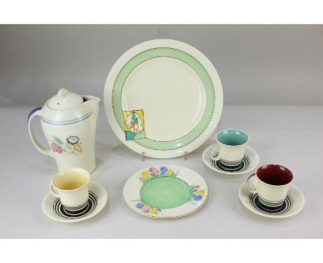 A Clarice Cliff Bizarre for Newport pottery plate, the green border with rectangular panel depicting a house in landscape, a 