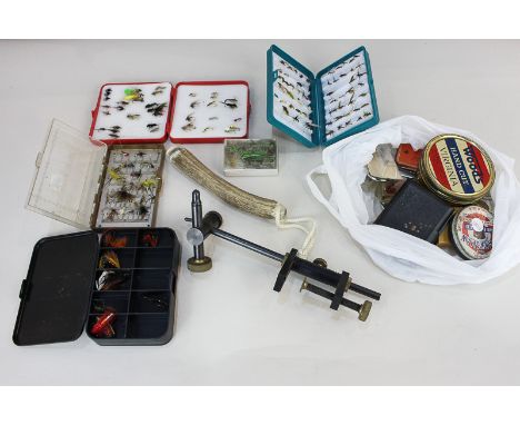 A collection of fishing equipment and accessories, including a stag horn priest, J Weaver and Son fly making tool, an assortm