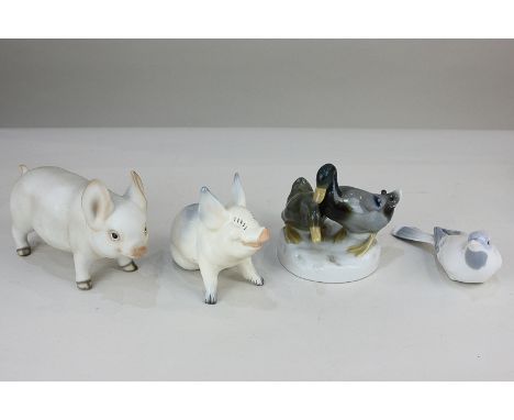 A Beswick porcelain pig, 9.5cm, a Continental porcelain bird and duck group, both with marks to base, and a ceramic piglet