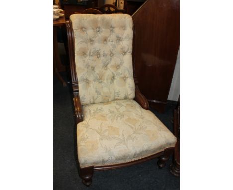 A Victorian  mahogany framed button back upholstered nursing chair on turned front legs (a/f - missing castors)