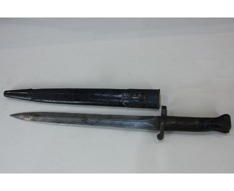 A Victorian bayonet with leather and metal scabbard, the 30cm blade marked with a crowned VR, initialed EFD '99