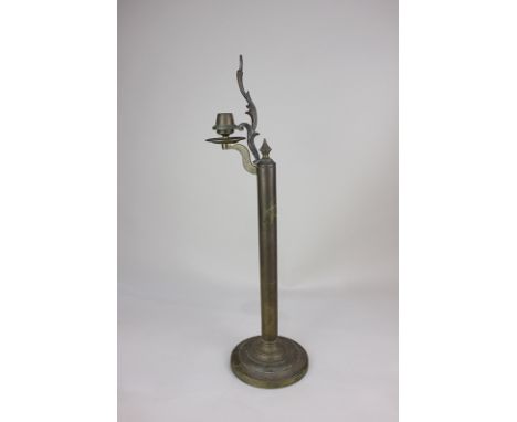 A Palmer & Co Victorian brass spring loaded candlestick with cast foliate decoration, 46cm high