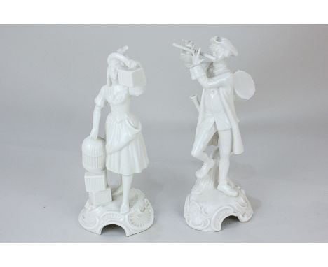 A pair of Goebel, West German, porcelain figures depicting a woman whistling with songbird, signed Bochman, and a musician pl