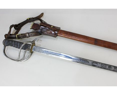 A George V Army Service Corp officer's sword, 86cm etched straight blade, with later leather scabbard, by repute belonged to 