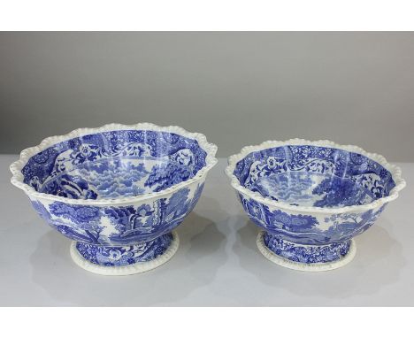 A graduated pair of Spode Italian pattern blue and white pedestal bowls with scalloped borders