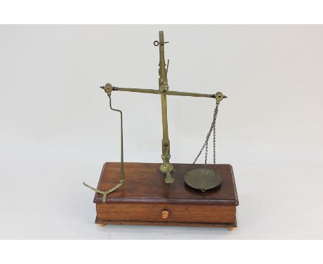 A set of brass scales by W & T Avery, on wooden base with drawer (a/f), 26cm