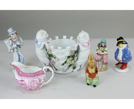 A Coalport figure of Paddington Bear (a/f), together with a Royal Doulton figure of a rabbit (a/f), a Spode cream jug in pink