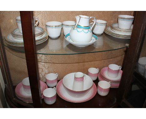 A Royal Worcester porcelain part tea service including six cups and saucers, side plates, cream jug, bowl and plate, decorate