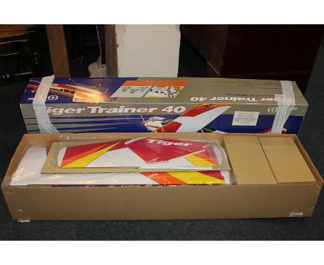 A Thunder Tiger 'Tiger Trainer 40 almost ready to fly' R/C aircraft kit, boxed, requires engine, propeller and other items fo
