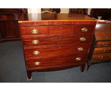 A mahogany chest of three short over three long graduated drawers, with ebony line inlay, raised on bracket legs, 118cm