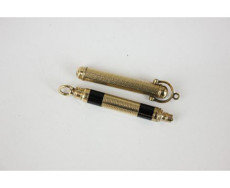 A Perry and Co gilt metal propelling pencil, engine turned outer sleeve with ring handle, pencil with pull action, marks to n