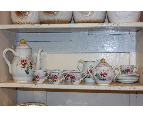 A Spode porcelain tea set for six, comprising teapot, sugar bowl, milk jug and six cups and saucers, decorated with pink rose