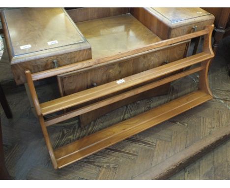 A light Ercol plate rack